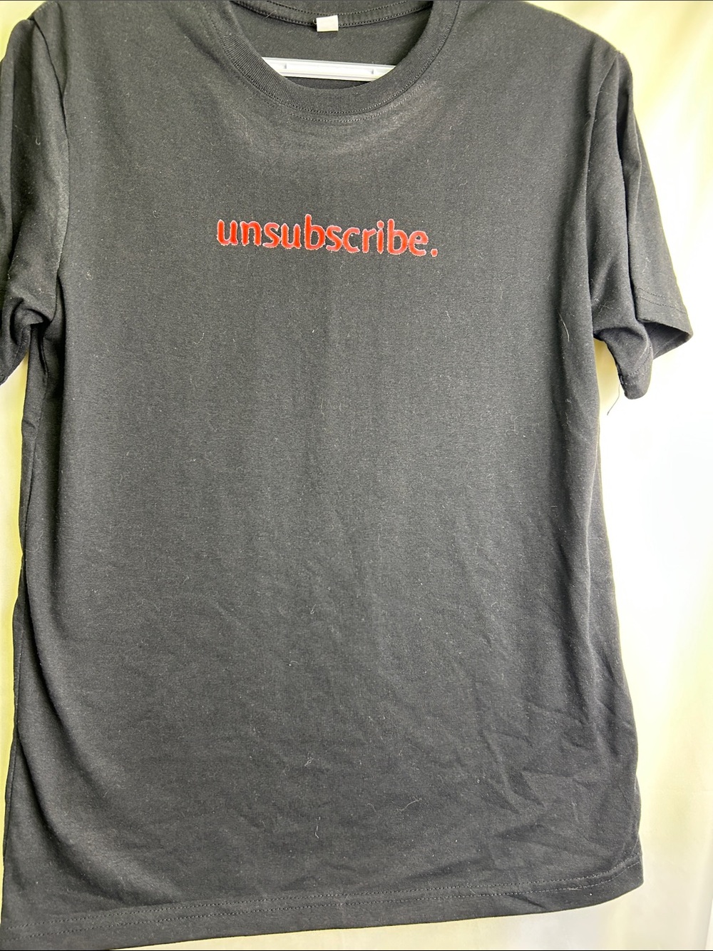 Men's Black Short Sleeve Tee with Red "unsubscribe." Graphic